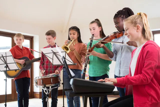 Students participating in a school music program supported by spiritwear fundraising